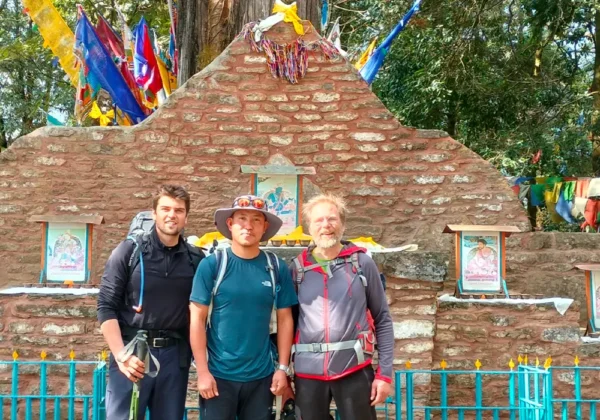 Tourist and guide Kassang standing infront of coronation throne a popular sightseeing destination in Yuksom