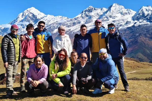 Trekking crew posing for a photo on a beautiful day. Mt Pandim in the backdrop on the Gechala Trek route, West Sikkim.